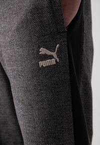Puma RELAXED TRACK PANTS - Trainingsbroek - black/alpine snow