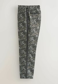 Patterned trousers in dark green and gray with a botanical print, featuring a black side stripe and a back pocket. Made from lightweight fabric.