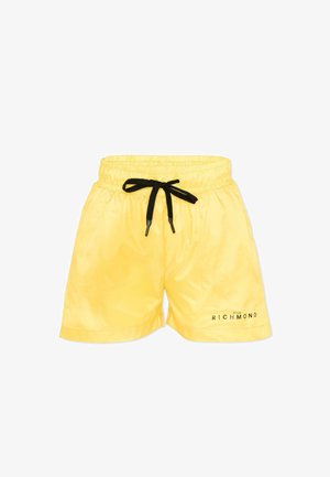 Shorts jaunes vifs avec ceinture élastique et cordon noir, portant le logo "John Richmond" sur la partie inférieure de la jambe droite.