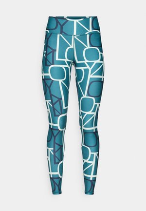 Petrolblauwe legging met een geometrisch patroon van overlappende vormen in donkerblauw en wit, gemaakt van een glad, rekbaar materiaal.