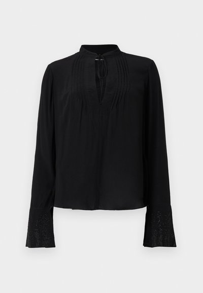 Black blouse with long sleeves, a collarless design, pleated front, and detailed cuffs featuring intricate embellishments. Smooth texture.