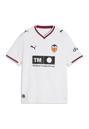 Valkoinen lyhythihainen jalkapallopaita viininpunaisilla reunoilla, Puma-logot, Valencia CF:n vaakuna ja musta TM Real Estate Group -sponsori edessä.