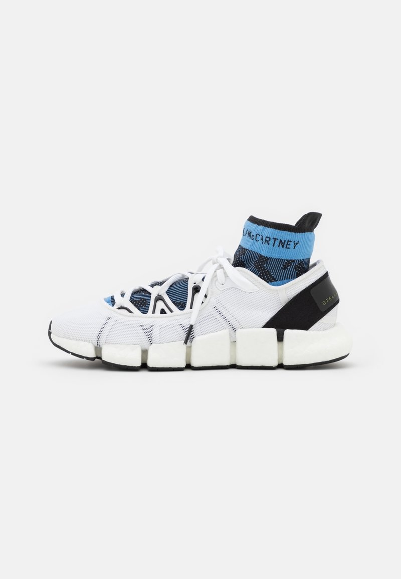 White athletic shoes with a textured mesh upper, blue and black sock-like collar, chunky white sole, and black accents on the heel.