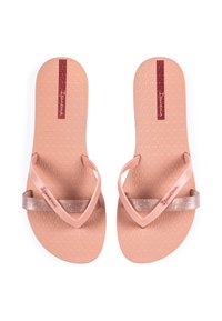 Pink rubber flip-flops with a textured footbed, featuring glossy glittery accents on the straps and logo embossed on the sole.