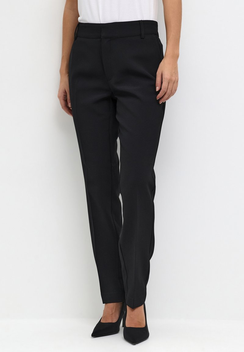 High-waisted black trousers made from a smooth fabric, featuring a tailored fit, straight legs, and clean lines, paired with black heels.