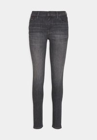 Jeans ajustados de mezclilla gris oscuro, que cuentan con un diseño clásico de cinco bolsillos, un ligero desgastado y un cierre con cremallera y botón.
