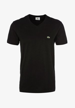 Zwarte katoenen T-shirt met V-hals, korte mouwen, voorzien van een klein groen Lacoste-logo op de linkerkant van de borst. Zachte, lichte stof.