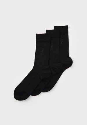 Black cotton socks, three-pack, featuring a smooth texture and ribbed cuffs. No visible patterns or additional accents.