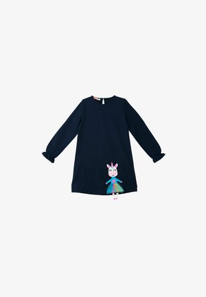 Tummansininen pitkähihainen mekko, jossa on röyhelökaulukset. Mekossa on yksisarvisapplikointi, värikäs tulo ja tähden yksityiskohta edessä.