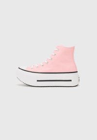 Pink canvas high-top sneakers with a thick white platform sole and black accent stripe. Features white laces and rubber toe cap.