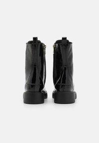 Love Moschino NEW CITY LOVE - Botas de tornozelo com plataforma - nero