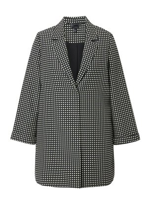 Blazer a pois bianco e nero con colletto a rotondo, maniche lunghe e taglio dritto. Realizzato in un tessuto texturizzato. Design aperto davanti.