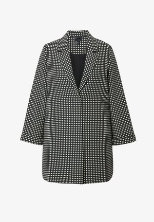 Mustavalkoinen pilkkuverkkoblausi, jossa on viistetty kaulus, pitkät hihat ja suora leikkaus. Valmistettu teksturoidusta kankaasta. Edestä auki oleva muotoilu.