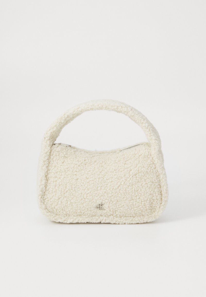 Borsa a tracolla bianca in materiale peloso, con manico curvo e chiusura con zip. Logo discreto sul davanti.
