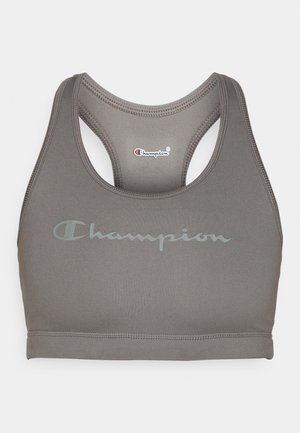 Top deportivo gris hecho de tela suave, con diseño racerback y un sutil logo de Champion en un gris más claro en la parte delantera.