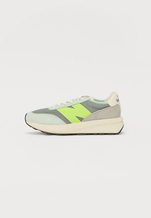 Sneakers with a light green upper, neon green accents, grey suede side panels, and a cream midsole. Features a textured rubber outsole.