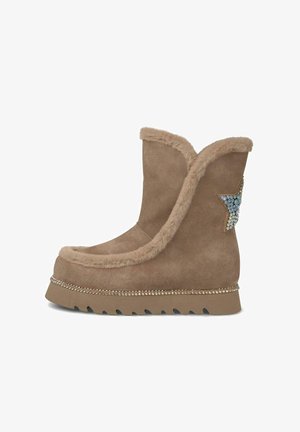 Brown suede boot with a fluffy collar, star accent embellished with blue rhinestones, and a ridged sole with decorative metal studs.