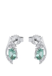 Silverörhängen med ovala gröna stenar omgivna av klara rhinestones, med en flytande, böjd design som framhäver ädelstenarna.