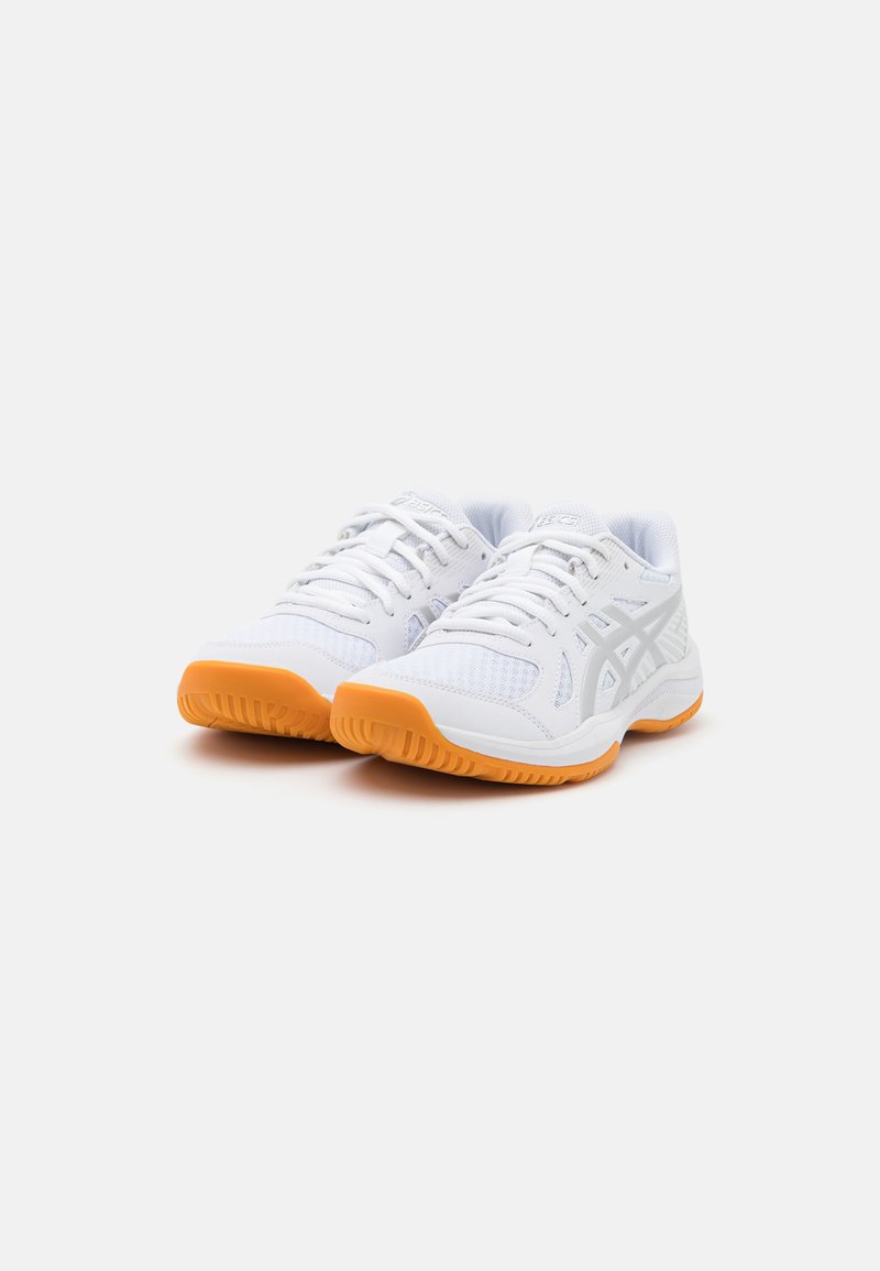 White athletic shoes with a mesh upper, silver accents, and orange rubber sole. Features lace-up closure and textured fabric for support.