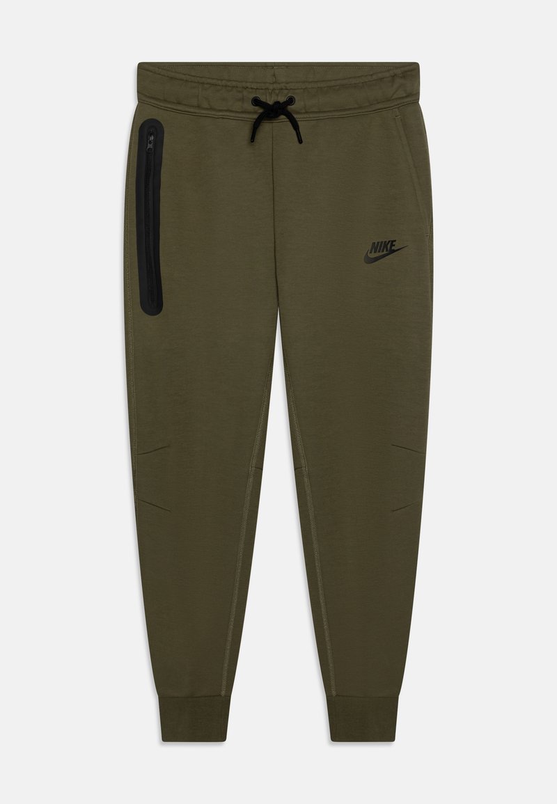 Olive vihreät collegehousut, joissa on elastinen vyötärö, säädettävä naru ja vetoketjullinen tasku. Sisältää mustan Nike-logon ja teksturoituja yksityiskohtia.