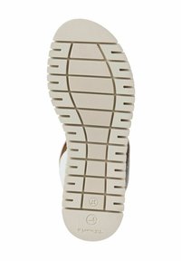 Semelle de chaussure en caoutchouc blanc avec un motif de grip texturé. Présente un bout arrondi et un logo estampillé près du talon. Taille 37 indiquée.