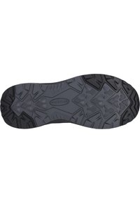 Svart strukturerad gummiyttersula med ett zigzag-mönster. Har djupa mönster för bra grepp och en central logotags som säger "WHISTLER."