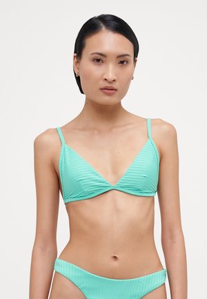 A mint green bikini featuring a ribbed texture, triangular cups, and thin adjustable straps. The bottom has a similar ribbed design.