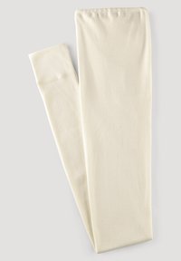 Světle béžové legíny vyrobené z měkké, elastické látky. Mají hladký povrch a jednoduchý, bezešvý design bez jakýchkoli vzorů či akcentů.