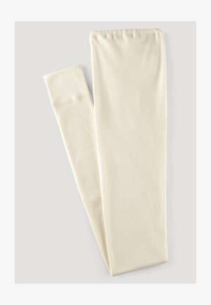 Helle beige Leggings aus weichem, dehnbarem Stoff. Sie verfügen über eine glatte Oberfläche und ein einfaches, nahtloses Design ohne Muster oder Akzente.