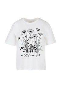 T-shirt blanc à manches courtes, orné d'un motif floral noir et du texte "wildflower club" en police cursive en bas.