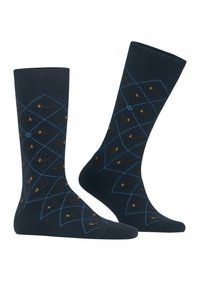 Granatowe skarpetki w diamentowy wzór z jasnoniebieskimi liniami i brązowymi wzorami psów, wykonane z miękkiego, elastycznego materiału.