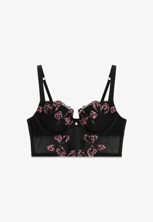 Soutien-gorge long en dentelle noire avec broderie florale violette et motif léopard, bretelles réglables et petit pendentif doré au centre devant.