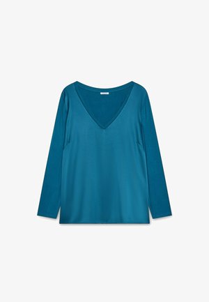 Top a maniche lunghe con scollatura a V in teal, realizzato in tessuto liscio. Presenta una vestibilità rilassata e un design semplice senza motivi o decorazioni.