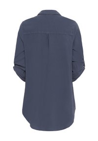 Navy blue shirt with a collar, flexible fabric, long sleeves rolled up, back yoke detail, and curved hem design.