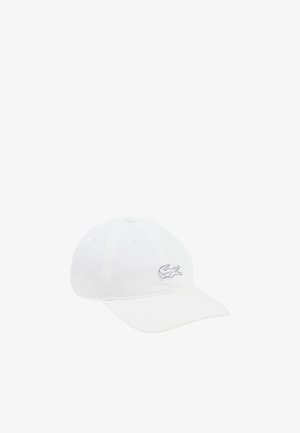 Gorra de béisbol blanca con visera curva y logotipo de cocodrilo bordado en el lado frontal derecho.