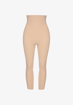 Beige shaping leggings med en høj talje, glat tekstur og sømløst design. Har en åbning ved skridtet for bekvemmelighed.