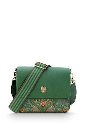 Green crossbody bag with a flat flap, floral and patterned detailing, a striped strap, and a circular gold hardware accent.