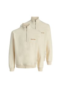 Sweat-shirts zippés demi-zip en crème clair, fabriqués en tissu doux, avec des poignets et un ourlet côtelé, arborant un petit logo brodé marron sur la poitrine.