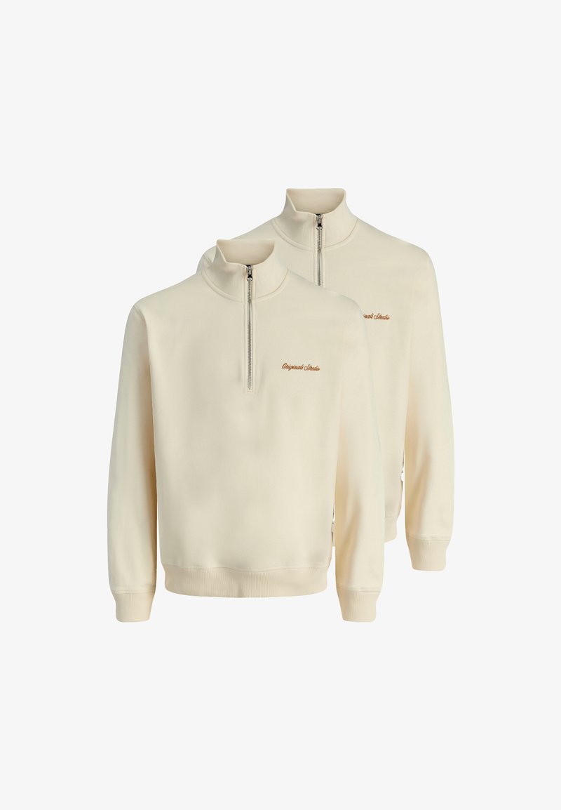 Felpe a metà zip in crema chiaro, realizzate in tessuto morbido, con polsini e orlo a costine, caratterizzate da un piccolo logo ricamato marrone sul petto.