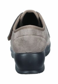 Brown suede shoe with a thick black rubber sole, featuring a padded collar and Velcro strap closure on the side.