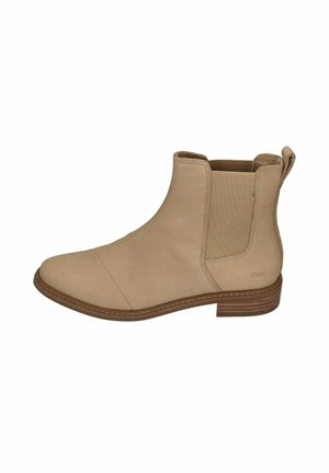 Beige Knöchelstiefel aus glattem Leder mit elastischen Einsatzpaneelen und einer Schlaufe zum Anziehen. Flacher Holzabsatz, genähte Details um die Sohle.