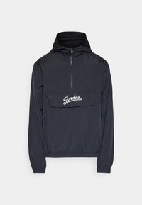 Black windbreaker jacket with a half-zip front, elastic cuffs, and a front pocket. Features white "Jordan" text and a textured hood lining.
