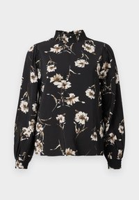 Svart bluse med lange ermer og høy gathered halslinning, med et blomster mønster i hvitt og beige, teksturert stoff og tettsittende mansjetter.