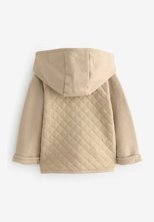 Vaalean beige huppari, jossa on svetarimainen takakappale, jossa on timanttikuvioita, pehmeä rakenne ja käänteiset hihat. Suunnittelu on yksinkertainen ja toiminnallinen.
