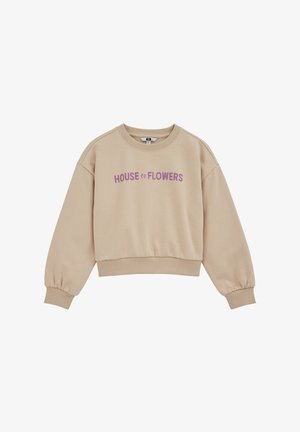 Bež pulover z rebrastimi manšetami, zaobljenim izrezom in napisom "HOUSE of FLOWERS" v vijolični barvi čez prsni koš. Gladek tekstura.