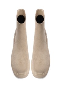 Stivali alla caviglia in suede beige con una superficie liscia e testurizzata, pannelli laterali elastici e suola in gomma. Punta arrotondata e design minimalista.