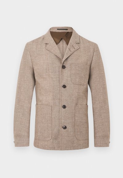 Ανδρικό μπεζ σακάκι με υφή, γιακά με χαμηλή εγκοπή, τέσσερα σκουρόχρωμα κουμπιά στο μπροστινό μέρος και τρεις τσέπες με ραφή.