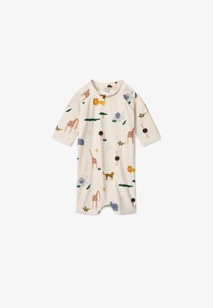 Short-sleeved romper in cream fabric featuring a colorful animal print, including lions, giraffes, and elephants, with soft, smooth texture.