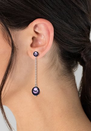 Purple bead earrings with silver chain. The design features a small bead near the earlobe and a larger bead hanging below.