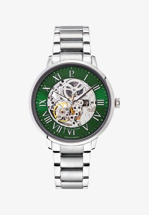 Srebrna avtomatska ura iz nerjavečega jekla s skeleton številčnico, zeleno ozadje in rimske številke. Ima vidne zobnike in poliran zaključek.